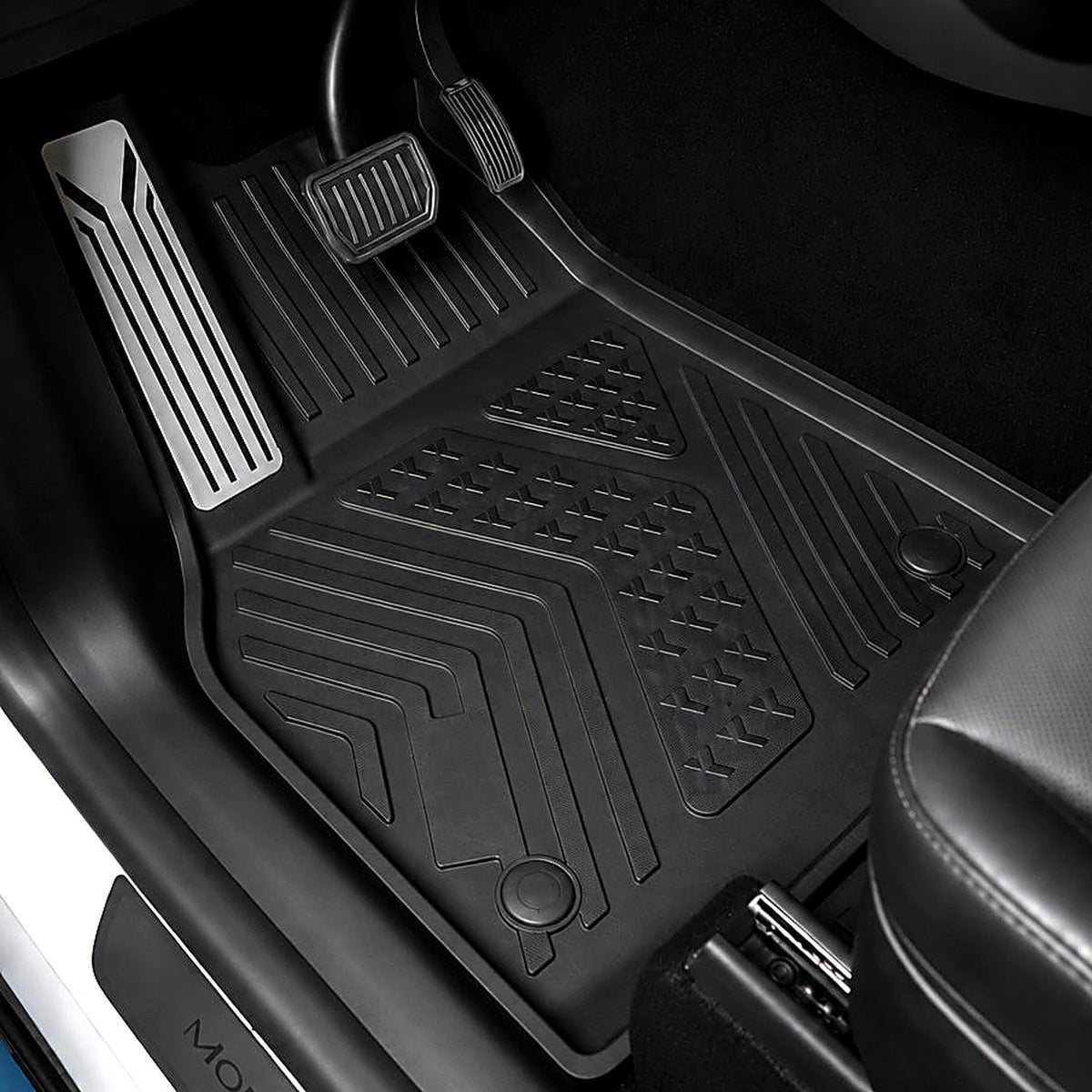 Driver-side liner installed with molded metal footrest