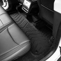 MoldedFit raised outer walls contain spills — Tesla Model Y Juniper floor liner